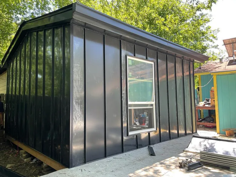 Black standing seam metal wall panels for Roof Inspection in Genesee