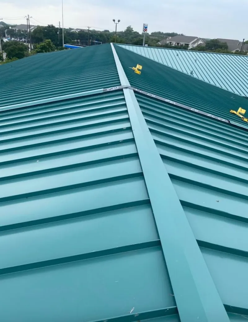 Green commercial metal roof ridge and valley for Metal Roof Repair in Genesee